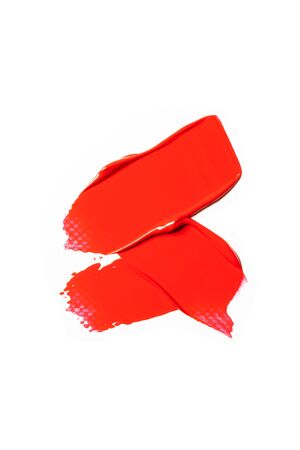 The texture of red lipstick on a white background, close-up.の写真素材