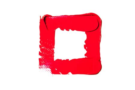 The texture of red lipstick on a white background, close-up.の写真素材