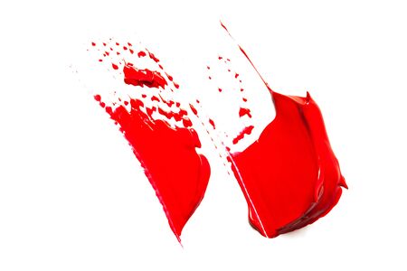 Texture of classic red lipstick on a white background close-up.の写真素材