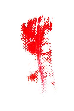 Texture of classic red lipstick on a white background close-up.の写真素材