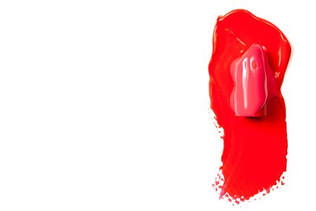 Texture of classic red lipstick on a white background close-up.の写真素材