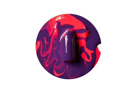 Violet lipstick in red paint on a white background.の写真素材