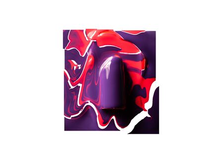 Violet lipstick in red paint on a white background.の写真素材