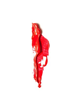 Red cosmetics for a woman. A sample on a white background.の写真素材