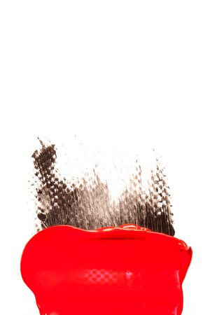Red cosmetics for a woman. A sample on a white background.の写真素材