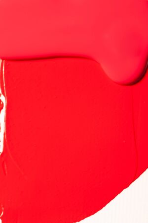 Red cosmetics for a woman. A sample on a white background.の写真素材