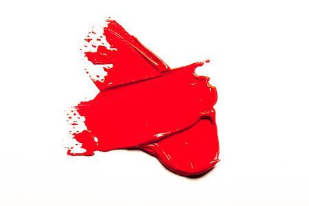 Beautiful photo of red lipstick, texture of red lipstick on a white background close-up.の写真素材