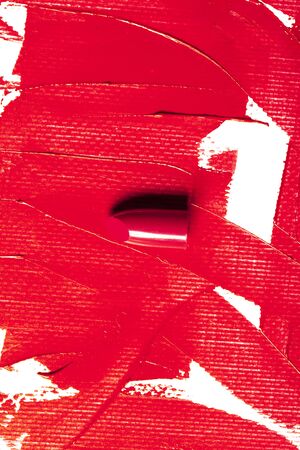 Beautiful photo of red lipstick, texture of red lipstick on a white background close-up.の写真素材