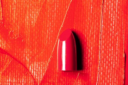 Beautiful photo of red lipstick, texture of red lipstick on a white background close-up.の写真素材