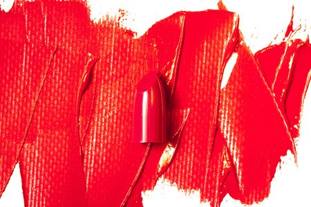 Beautiful photo of red lipstick, texture of red lipstick on a white background close-up.の写真素材
