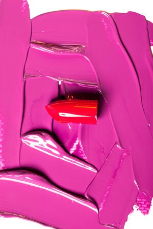 Beautiful photo of red lipstick, texture of red lipstick on a white background close-up.の写真素材