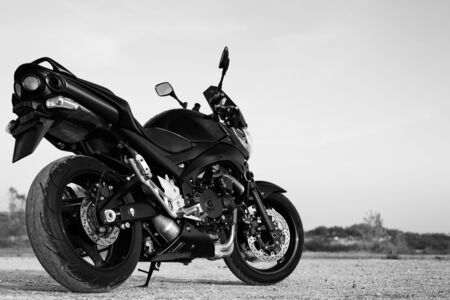 Black sports motorcycle close-up on the street.の写真素材