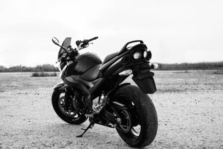 Black sports motorcycle close-up on the street.の写真素材