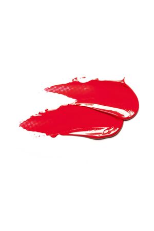 Texture of classic red lipstick on a white background close-up.の写真素材