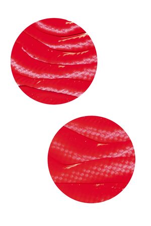 Texture of classic red lipstick on a white background close-up.の写真素材