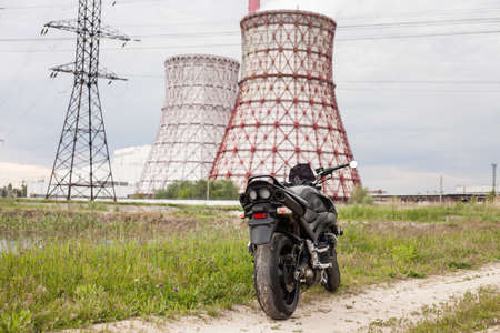 Sports black motorcycle near the power plant.の写真素材