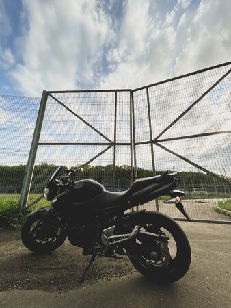 Black motorcycle close-up on the street.の写真素材