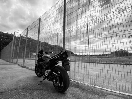 Black motorcycle close-up on the street.