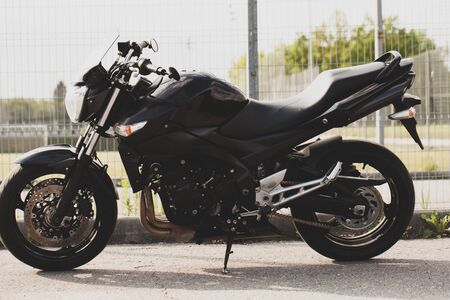 Black motorcycle close-up on the street.の写真素材