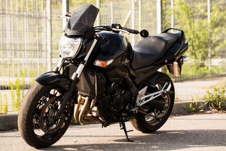 Black motorcycle close-up on the street.の写真素材