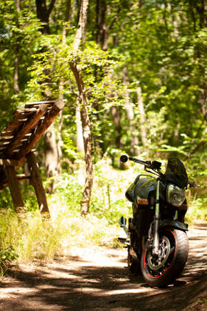 Sporty black Suzuki motorcycle in nature.のeditorial素材