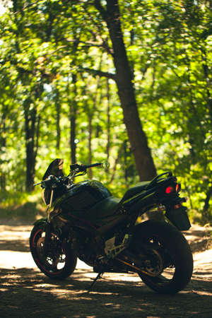 Sporty black Suzuki motorcycle in nature.のeditorial素材