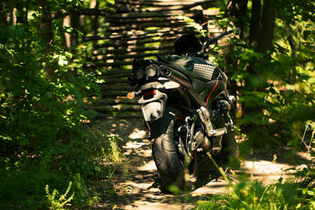 Sporty black Suzuki motorcycle in nature.のeditorial素材