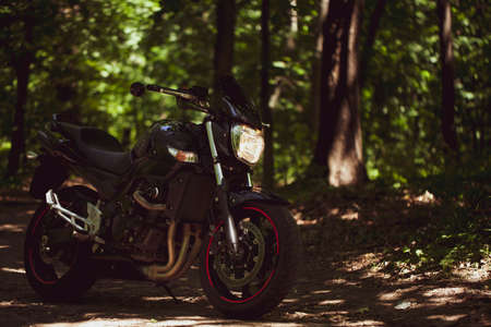 Sporty black Suzuki motorcycle in nature.のeditorial素材