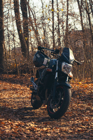 UKRAINE, KIEV - NOVEMBER 22, 2020: Powerful black motorcycle Suzuki GSR600 in forest autumn.のeditorial素材