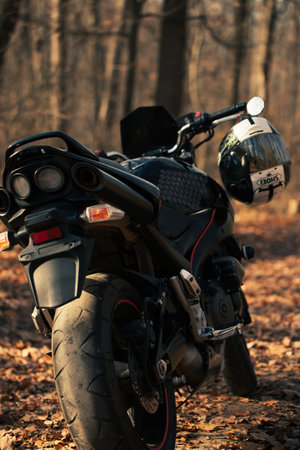 UKRAINE, KIEV - NOVEMBER 22, 2020: Powerful black motorcycle Suzuki GSR600 in forest autumn.のeditorial素材
