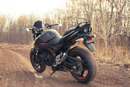 UKRAINE, KIEV - NOVEMBER 22, 2020: Powerful black motorcycle Suzuki GSR600 in forest autumn.のeditorial素材