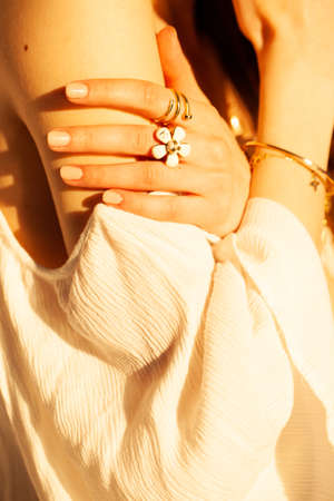 Beautiful gold jewelry on a girl close-up.