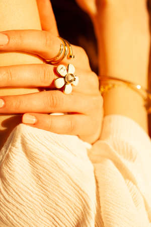 Beautiful gold jewelry on a girl close-up.の写真素材