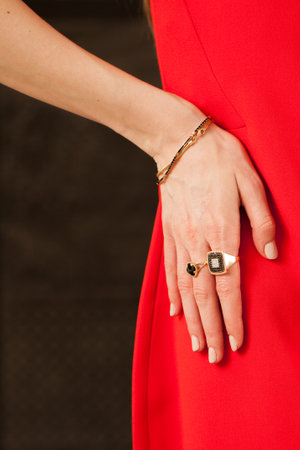 Beautiful gold jewelry on a girl close-up.の写真素材