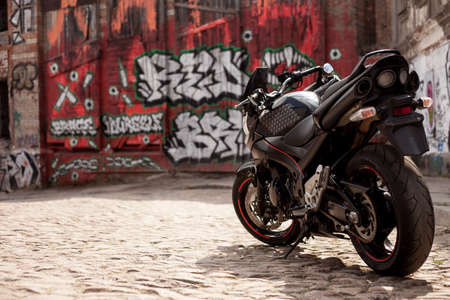 UKRAINE, KIEV - JULY 10, 2021: Suzuki GSR600 sport black motorcycle on graffiti background.のeditorial素材