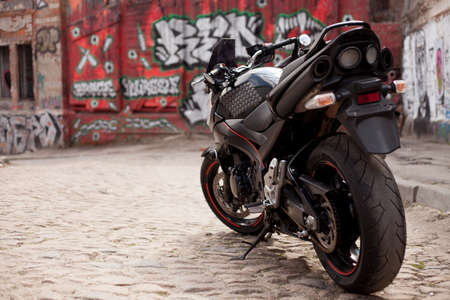 UKRAINE, KIEV - JULY 10, 2021: Suzuki GSR600 sport black motorcycle on graffiti background.のeditorial素材