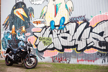 UKRAINE, KIEV - JULY 10, 2021: Suzuki GSR600 sport black motorcycle on graffiti background.のeditorial素材