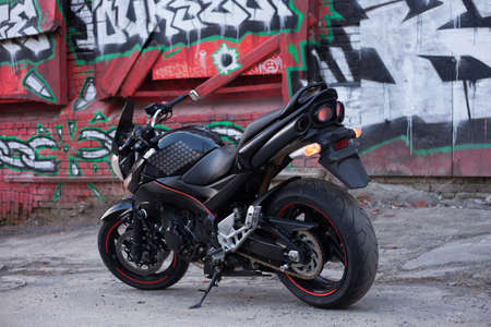 UKRAINE, KIEV - JULY 10, 2021: Suzuki GSR600 sport black motorcycle on graffiti background.のeditorial素材