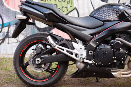 UKRAINE, KIEV - JULY 10, 2021: Suzuki GSR600 sport black motorcycle on graffiti background.のeditorial素材