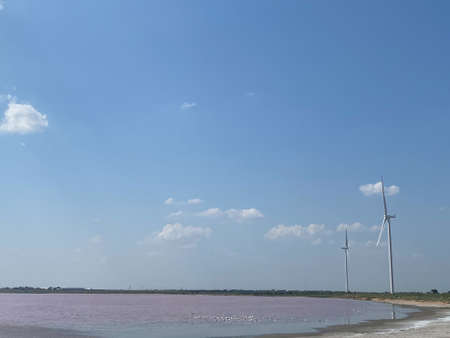 Modern electric mills and the sea.の写真素材