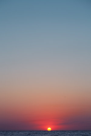 Peace and quiet on the seashore at sunset.の写真素材