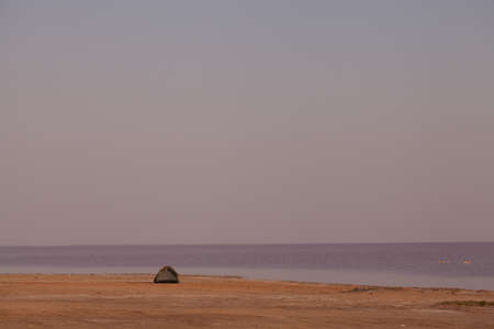 Peace and quiet on the seashore at sunset.の写真素材