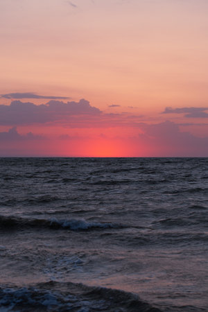 Peace and quiet on the seashore at sunset.の写真素材