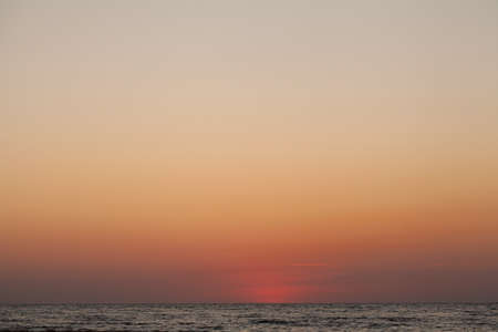 Peace and quiet on the seashore at sunset.の写真素材