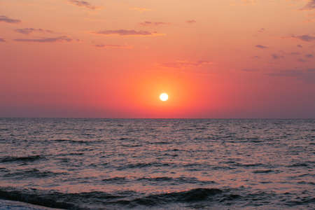 Peace and quiet on the seashore at sunset.の写真素材