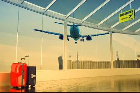 passenger plane flying over airport terminal - traveling luggage at airport terminalの写真素材