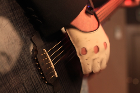 Hands of a rock musician with acoustic electric guitar closeupの写真素材