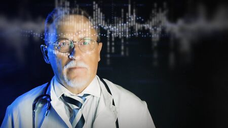 Mature doctor in white medical lab coat on dark background. Medium shot portrait elderly scientist in high tech laboratory. Handsome gray haired old doctor looking at augmented reality screen.の写真素材