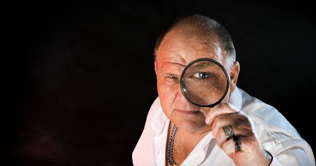 old man portrait on a black backgroundの写真素材