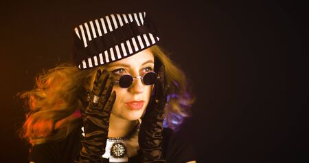 Portrait of vintage woman in classic hat. Retro styling girl. Retro portrait of a fashion elegance...